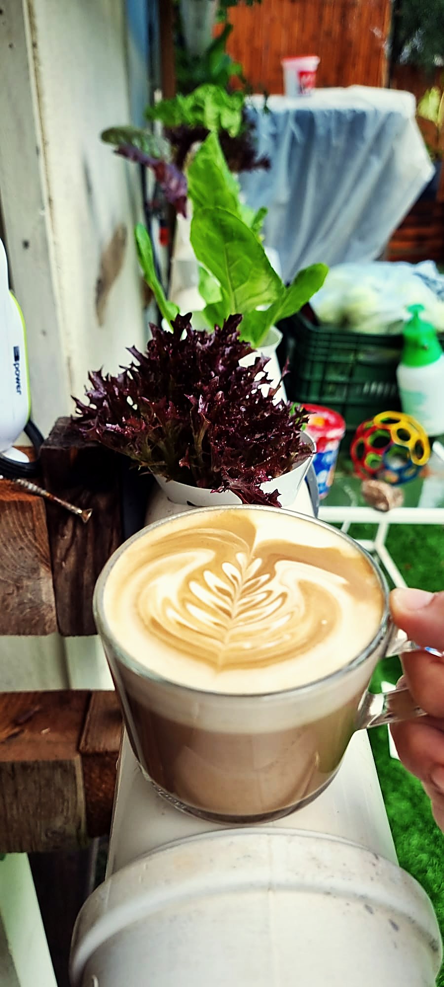 Latte art rosetta poured in a glass